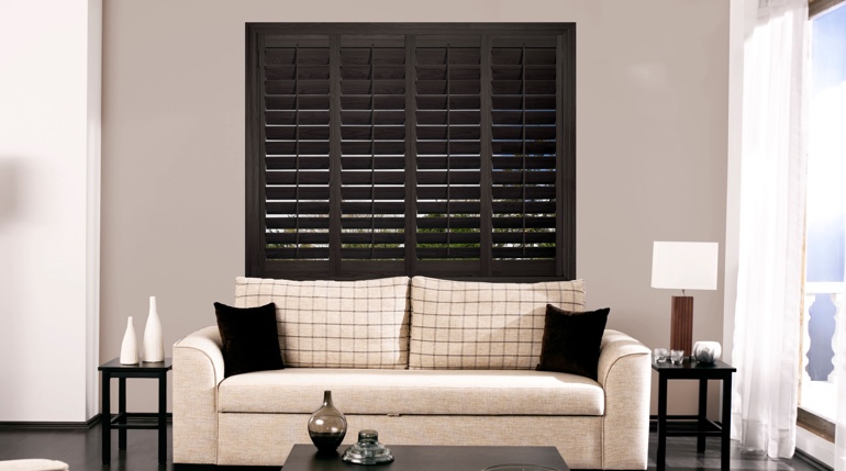 Miami living room with black shutters.